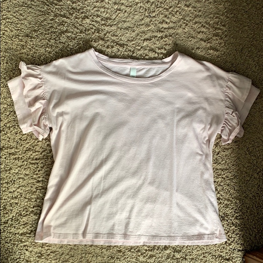 Light pink top with ruffle detail on sleeve